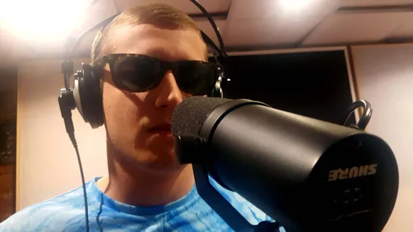 A singer at a Shure microphone