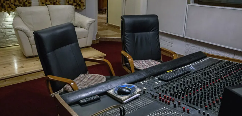 The console seen from the sofa side, with acoustic diffusers on the wall