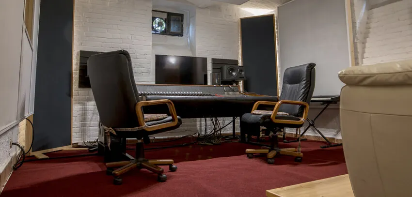 Two chairs at the console, with the sofa behind them