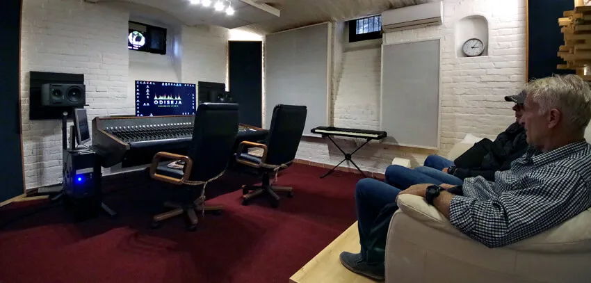 Clients listening from the sofa in the control room