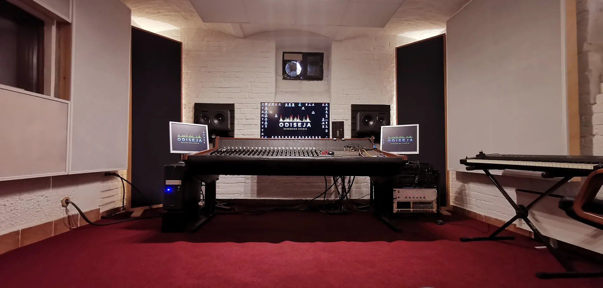 The control room with the mixing console and monitors