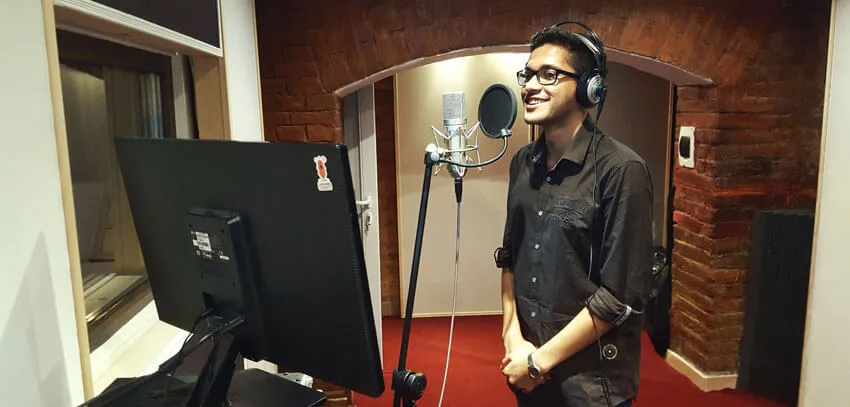 A singer recording vocals in the studio